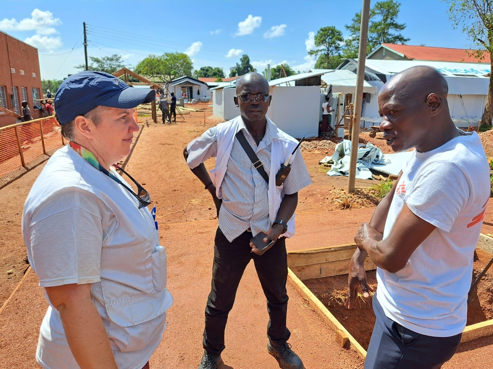 MSF staff discuss the plans for a 39-bed Ebola Treatment Centre in Mubende