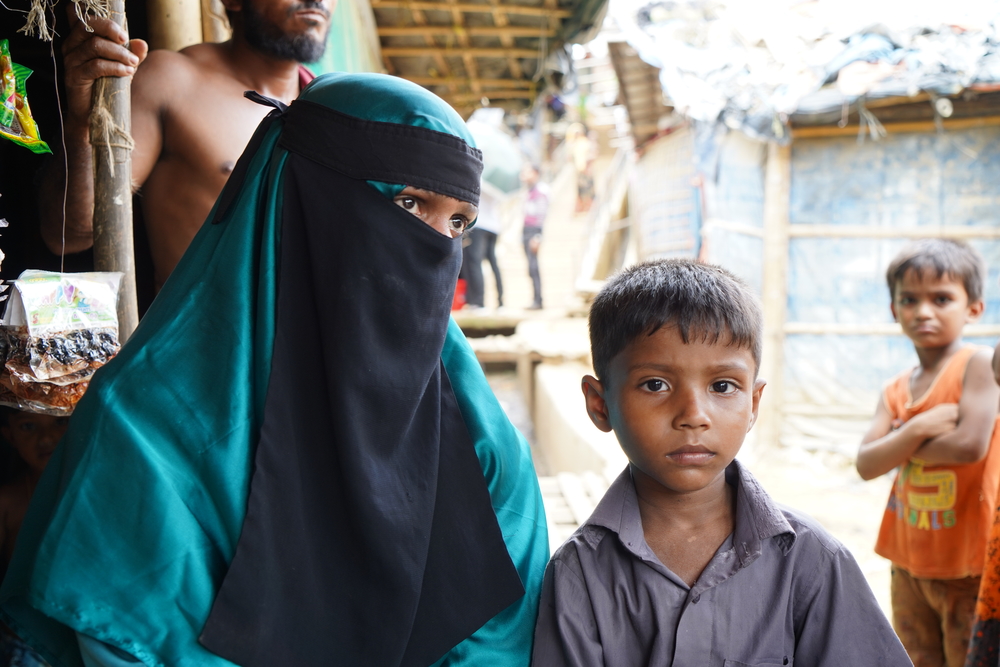 Rohingya refugee Bibi Jan sits at a tea stall with her five year old son, Fayezorahman, in Kutupalong megacamp [ ©Dalila Mahdawi/MSF]