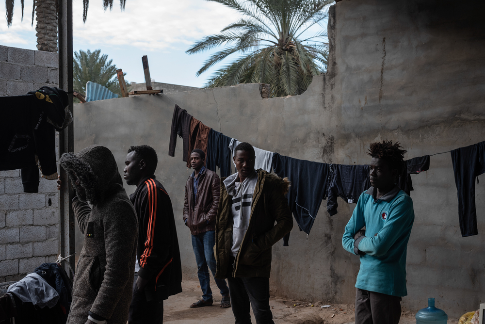 Refugees mostly from Darfur, Sudan are gathered in the courtyard of the place where they live in Gorgi district, south of Tripoli. 