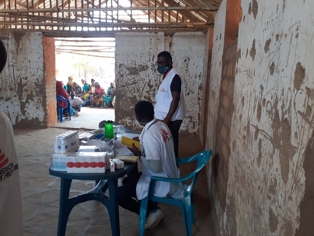 MSF teams prepare to receive patients for medical consultations at a school in Impire Village