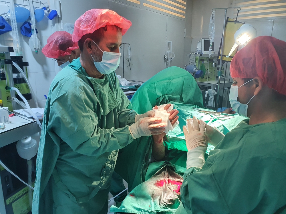 MSF surgical teams perform an operation on a patient injured by the fighting in Kunduz 