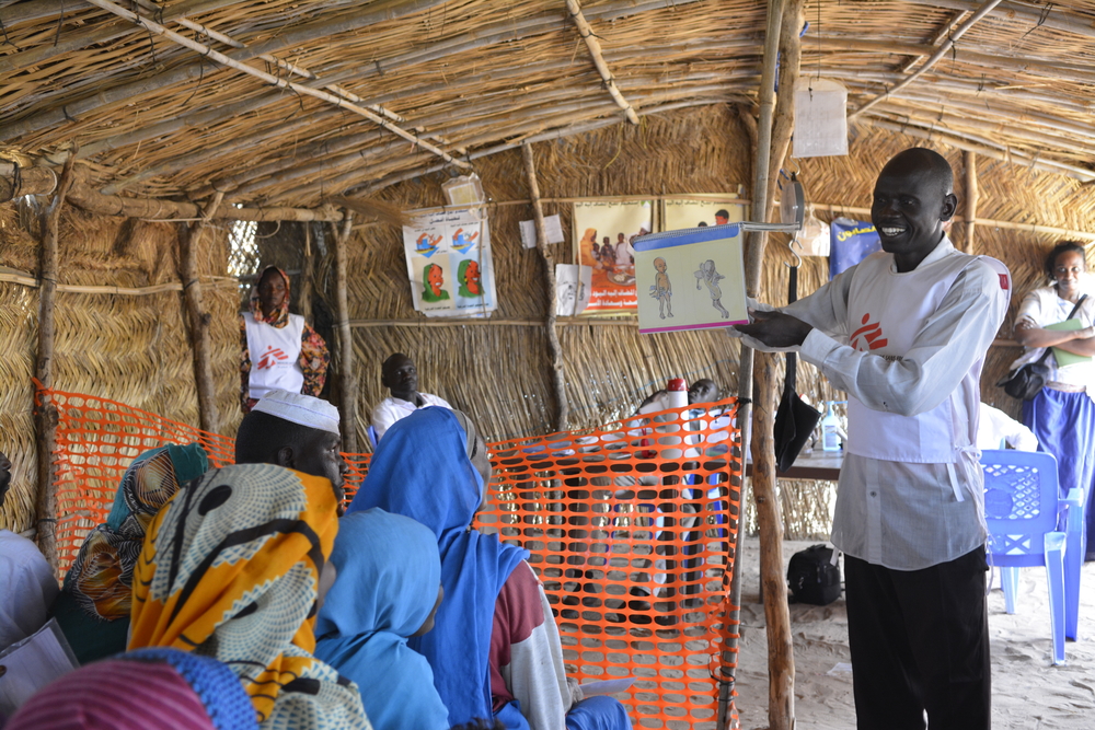 Antony, MSF’s health promoter, during an information session in Kario [© MSF/Jinaane Saad]