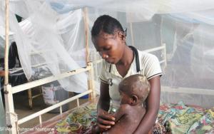 Mompondele Yangala, a 1-year-old child suffering from Mpox, in his mother's arms, hospitalised at the Bolomba general referral hospital, supported by MSF. His mother had also been treated for the disease.
