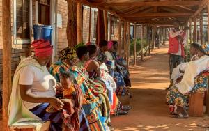 Health promoter, Bayubahe Jerome, educates mothers on the benefits of breastfeeding at Nduta Camp Clinic.