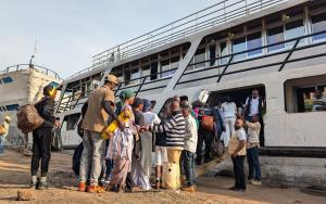 People jump on a ship at the port of Bukavu, capital of South Kivu province, eastern Democratic Republic of Congo. Some navigation through Lake Kivu was restablished today 18 February 2025