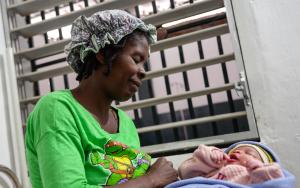 Yvane smiles with her baby