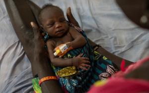 A mother holding a child