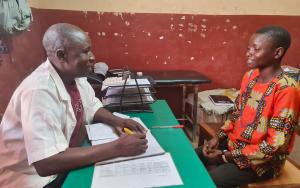Adolphe Andao, 22, a type 1 diabetes patient, during a consultation with an MSF health worker at the chronic disease follow-up clinic in Carnot Hospital.