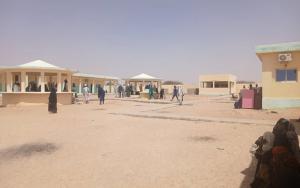 People walk around the compound of a hospital in Tiné. Chad, March 2026.