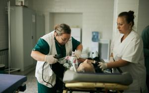 MSF staff are taking care of a 84 year old patient just admitted by ambulance at one of the hospitals in Mykolaiv region