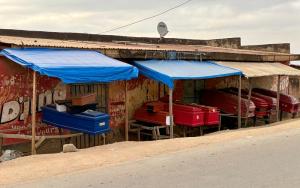 Empty coffins are on display for sale along a road in Bunia, Ituri, in the Democratic Republic of the Congo.