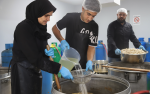 Cooked food distribution in Azarieh shelter
