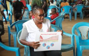 A person holding a calendar, symbolizing tracking menstrual cycles and learning about periods.