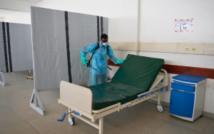 Mwachiro Ngala Mangale, hygeinist disinfecting a patient bed in the severe adult male ward at Utange isolation center. 