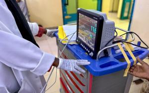 A medical staff is watching the monitor screen while checking a patient’s vital signs in the maternity ward of the hospital.
