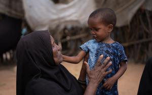 Abdiya Hussein Biri, a newly arrived, unregistered and unprofiled refugee with her child.