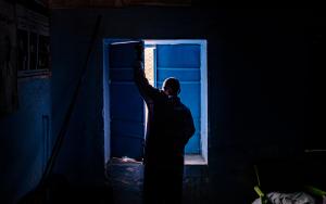 Medical assistant Jaffer Sadiq Abaker Saleh, closes the shutters at a primary health care centre which is no longer fully functional due to funding cuts. Hamidya IDP camp, Zalingei.