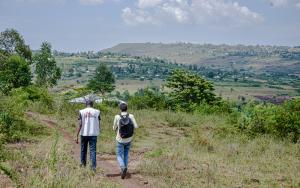 MSF staff walking in the field heading for a call-back during the NHIPS survey.