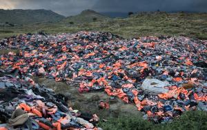 Thousands of life jackets left behind by arriving migrants are gathered at a dump on Lesbos Island, Greece.  [ © Robin Hammond/Witness Change]