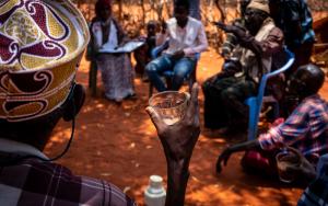. The MSF tea team chats with community leaders and elders of Kurtunle village during the monthly tea team focus group meeting  [ © Susanne Doettling / MSF ] 