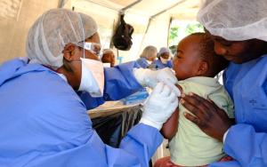 Two-and-half year old Justin* receives his shot the investigational Ebola vaccine rVSV-ZEBOV,at a vaccination point set up in the community of Kimbangu in the city of Beni. [© Samuel Sieber/MSF ]
