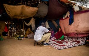 Community outreach staff in one of the refugees' homes - Sept 2019
