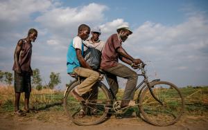 Manfred being helped to go to the Ndamera Health Centre while some of his friends are seeing him off. [Photo: Isabel Corthier/MSF]