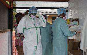 Medical staff dress with PPE to enter the treatment unit 
