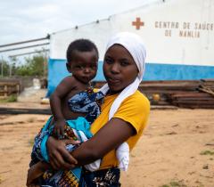Marcia, a resident of Nanlia community, visited the health center for a medical follow-up for her daughter. Nanlia Health Center serves a population of 61,180, including many displaced by the conflict.