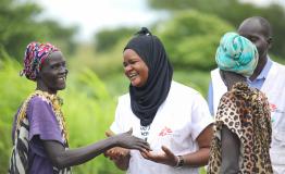 MSF Nurse Activity Manager for Abyei, Awa Abdumadou shares light moments with two community volunteers during a weekly visit to one of the 17 Integrated Community Case Management (ICCM) sites in Abyei