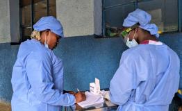 Two health workers talk at the Budjala general hospital, supported by MSF. MSF also deployed a team in the Budjala health zone in South Ubangi to support health authorities in the response against Mpox