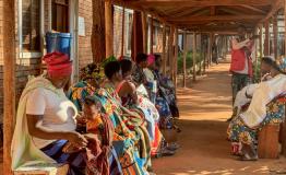 Health promoter, Bayubahe Jerome, educates mothers on the benefits of breastfeeding at Nduta Camp Clinic.