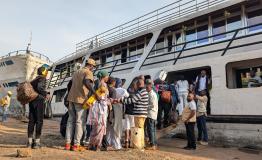 People jump on a ship at the port of Bukavu, capital of South Kivu province, eastern Democratic Republic of Congo. Some navigation through Lake Kivu was restablished today 18 February 2025