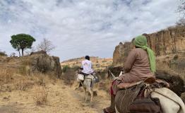 MSF team on their way to Dilli village to deliver healthcare supplies. Jebel Marra Mountains, Darfur Region. Sudan