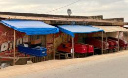 Empty coffins are on display for sale along a road in Bunia, Ituri, in the Democratic Republic of the Congo.
