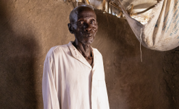 James Kuong Madeng, 60 years old, suffering from TB/HIV is standing inside his house in Leer.