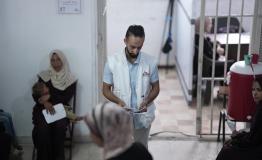MSF staff arranging the entry of patients to the medical staff in Gaza clinic in Gaza city. 