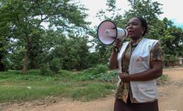 Gertrude raises awareness on cholera infection and spread  in Mulongo's neighborhoods