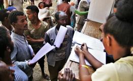 Administrators register newly arrived displaced people at Tsegay Berhe