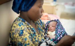 A mother with her new-born in Mrima Hospital 