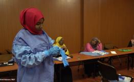 A Sudanese health professional dresses in PPE during a training by MSF (March 2020)