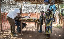 Families register for the measles vaccination campaign in  Botulu, Boso Manzi health zone