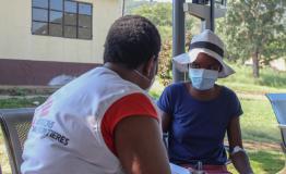 MSF nurse giving a training to a female MDR-TB patient in Matsanjeni health centre how to use Video 