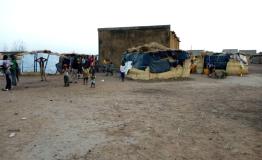 Displaced families live in makeshift shelters in Fada, 