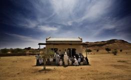 An MSF team talks to a group of men in Dar Zaghawa, in North Darfur state