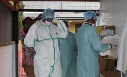 Medical staff dress with PPE to enter the treatment unit 