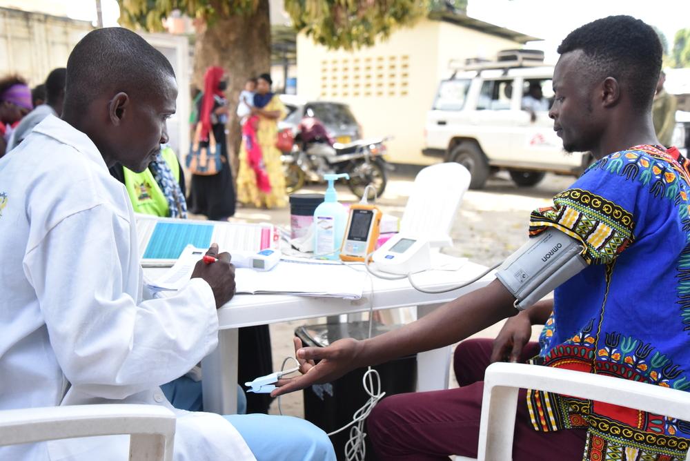 A Ministry of Health official takes a youth through triage at the youth friendly service centre in Mombasa, Kenya.