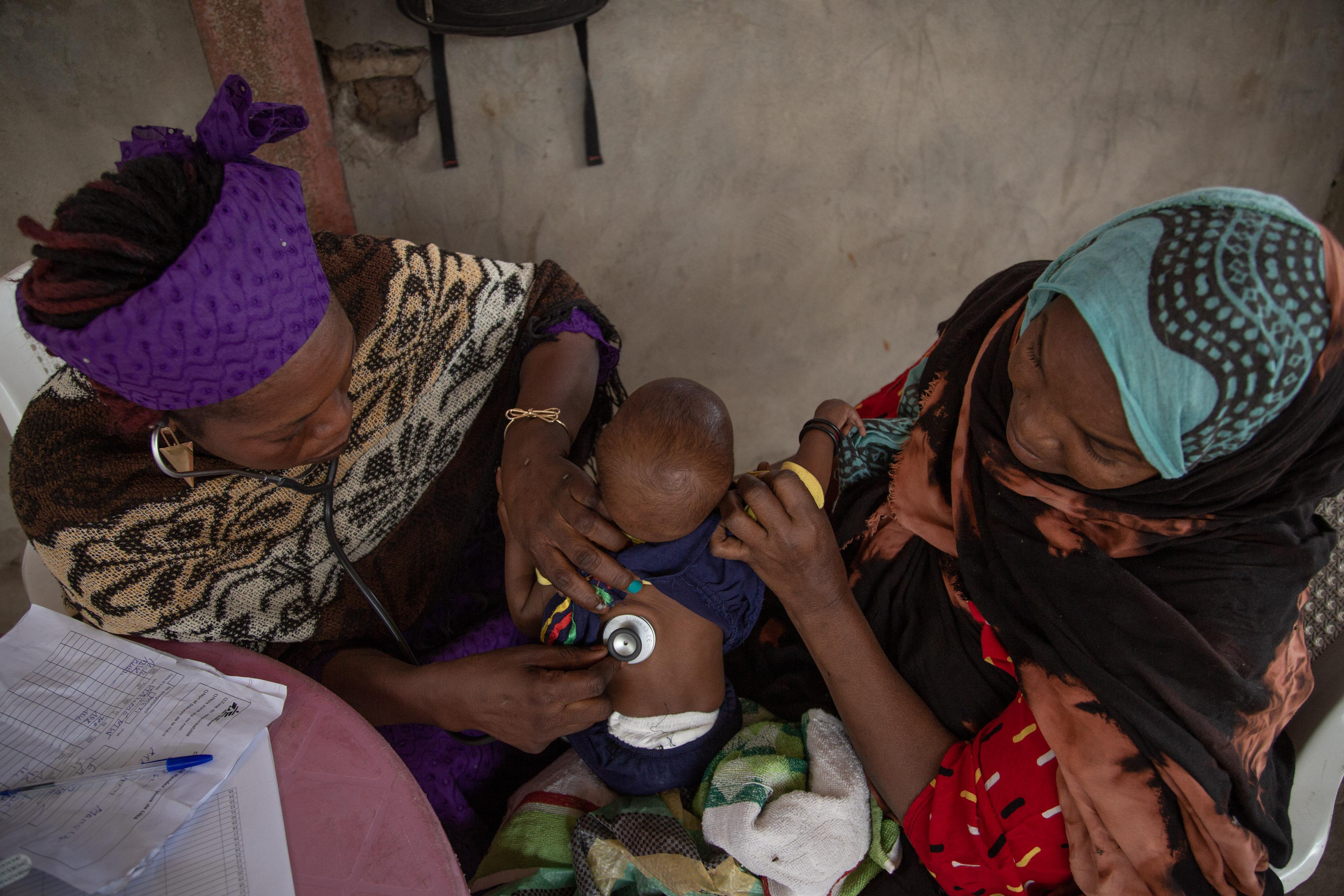 Nurse Ndoungamandji Solange, examines a child in Massakori, Chad