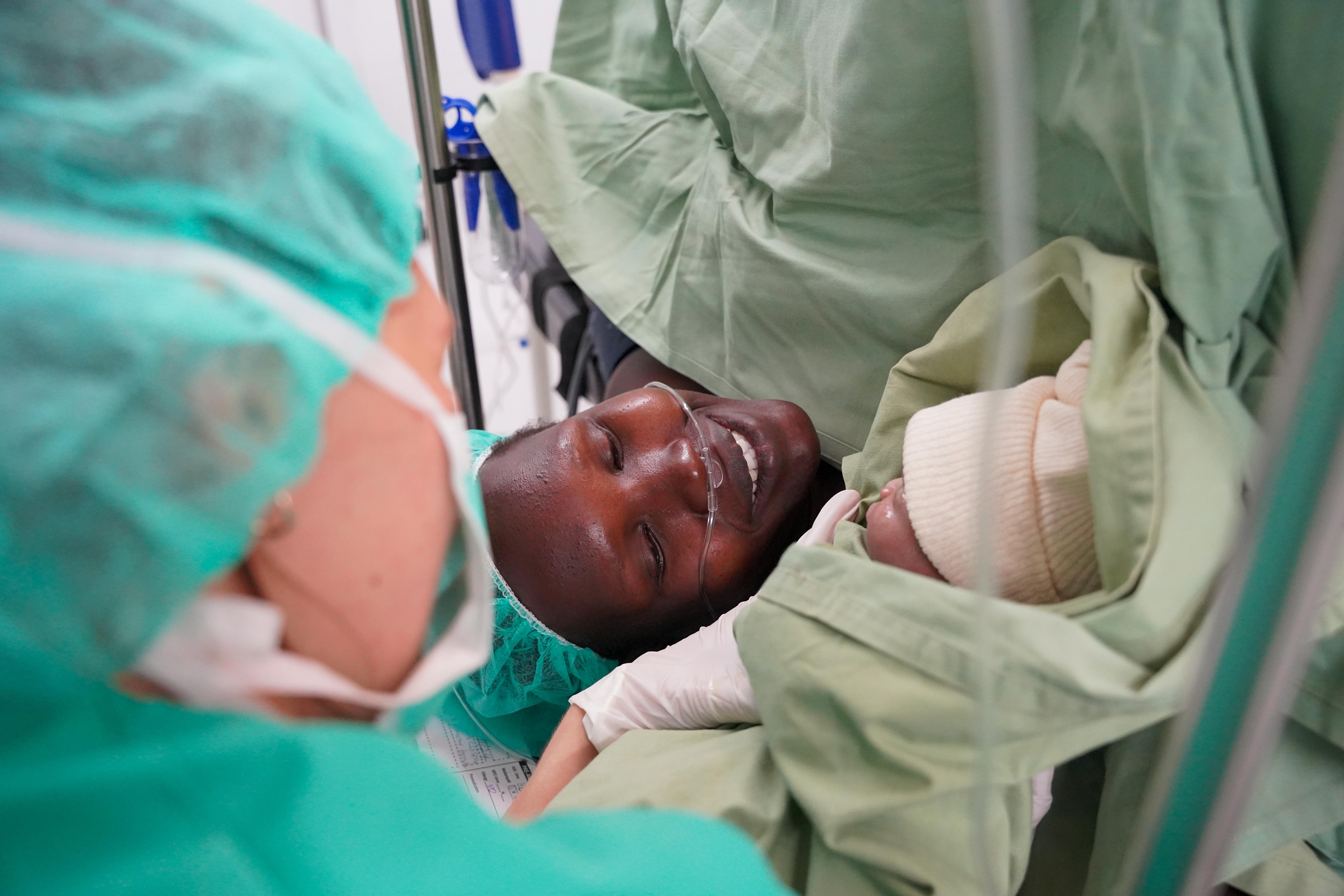 Ita Joice meets her baby girl, Juan, during her caesarean section in Mundari County hospital