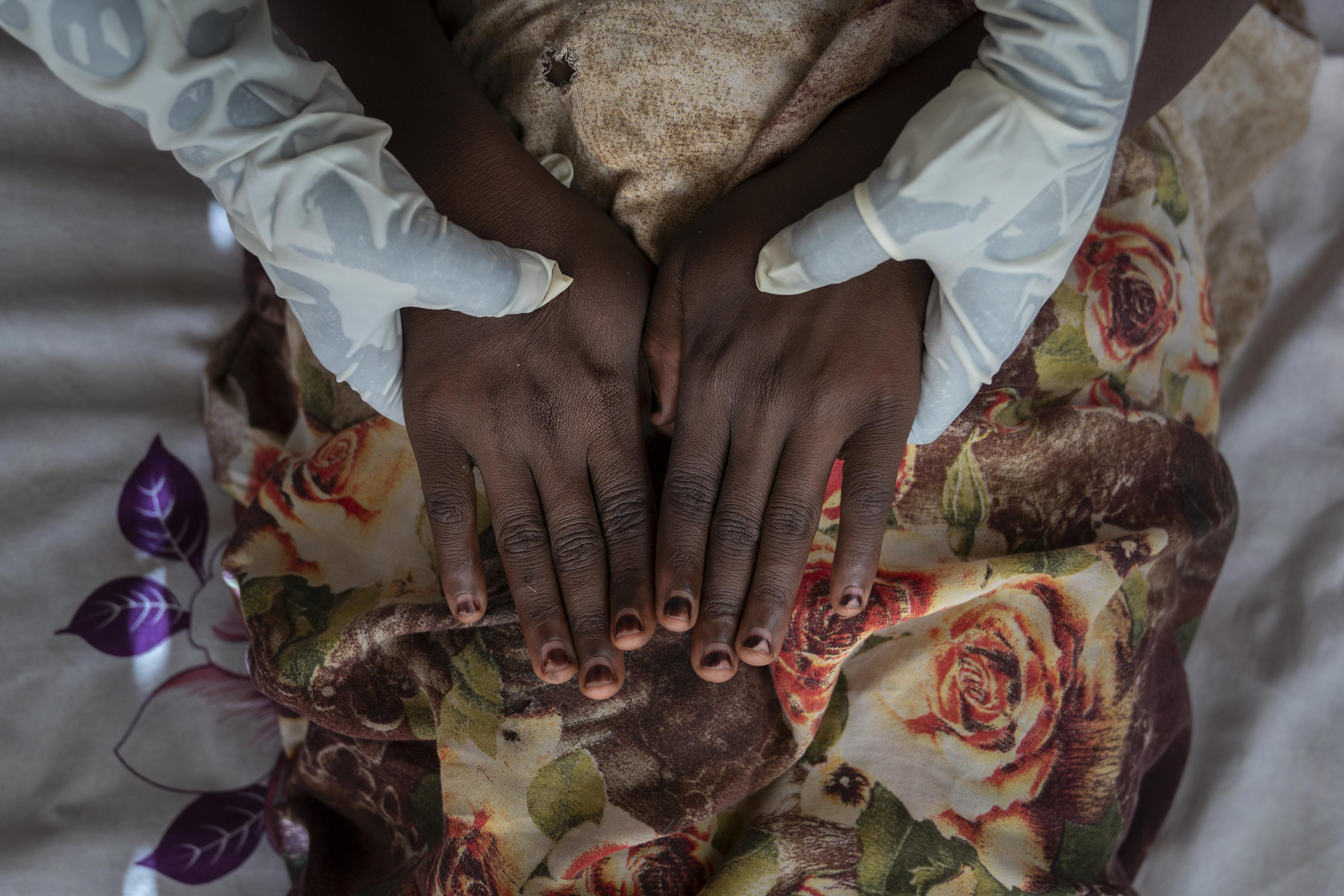 Pregnant Sudanese women visit a midwife at her home for a prenatal consultation.